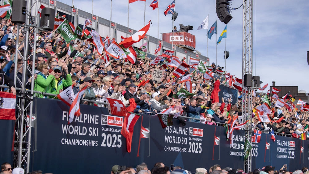 Crowd of fans with flags at the FIS Alpine Ski World Championships 2025.